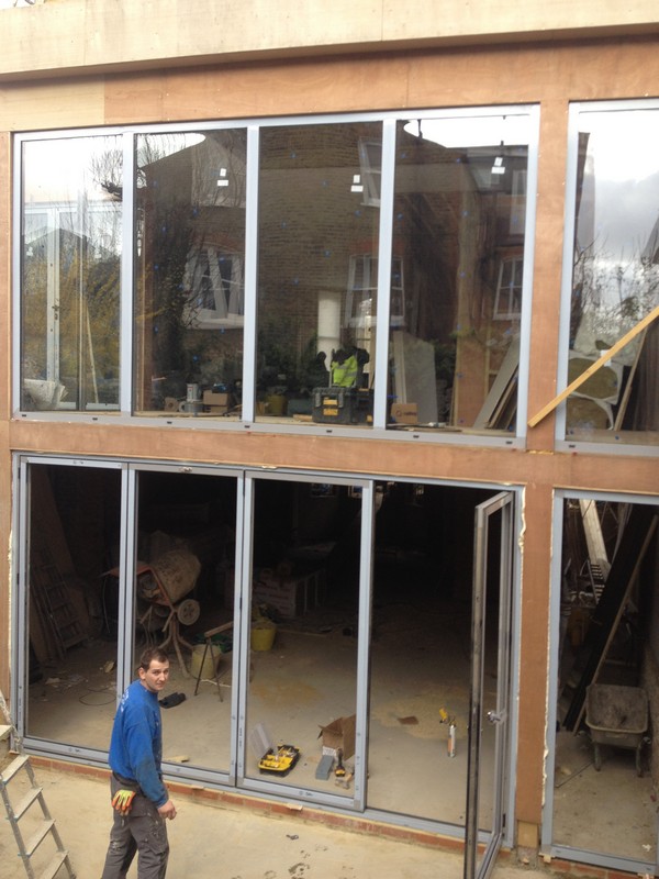 Aluminium bi-fold doors with two-storey glazing in Rickmansworth
