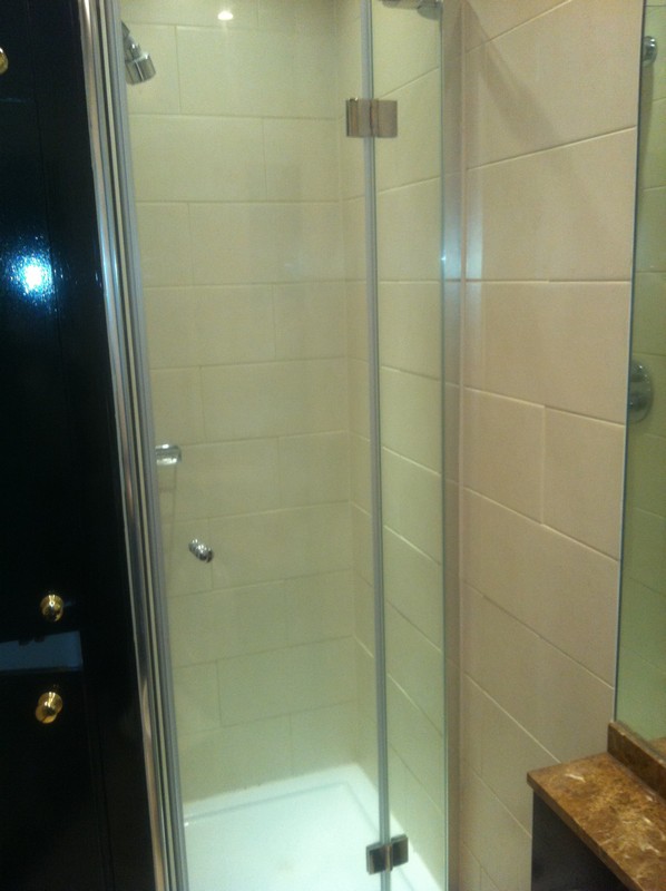 Frameless glass shower enclosure with chrome fittings in Rickmansworth