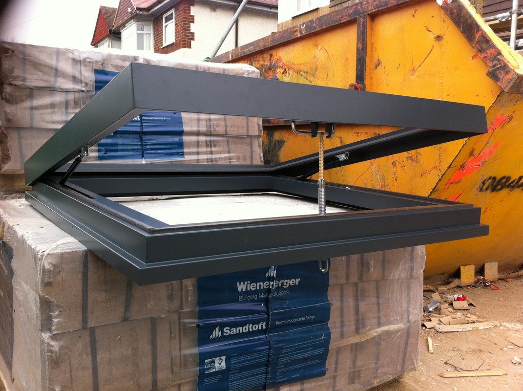 Opening flat roof skylight in anthracite grey installed in Rickmansworth